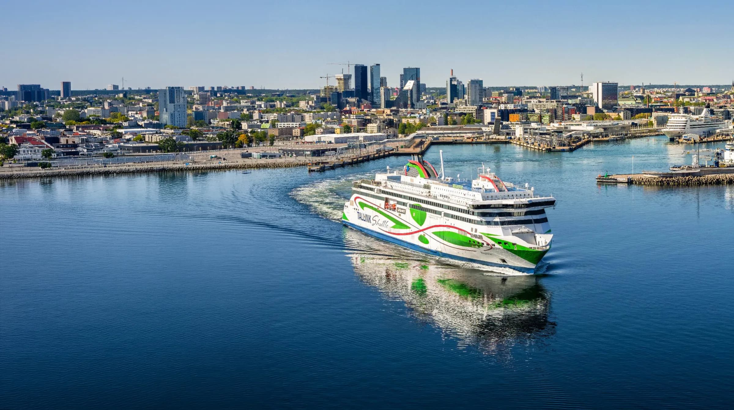 A ferry arriving in Tallinn harbour with the city skyline behind
